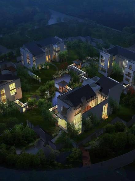 A serene nighttime aerial view of illuminated houses surrounded by lush greenery.