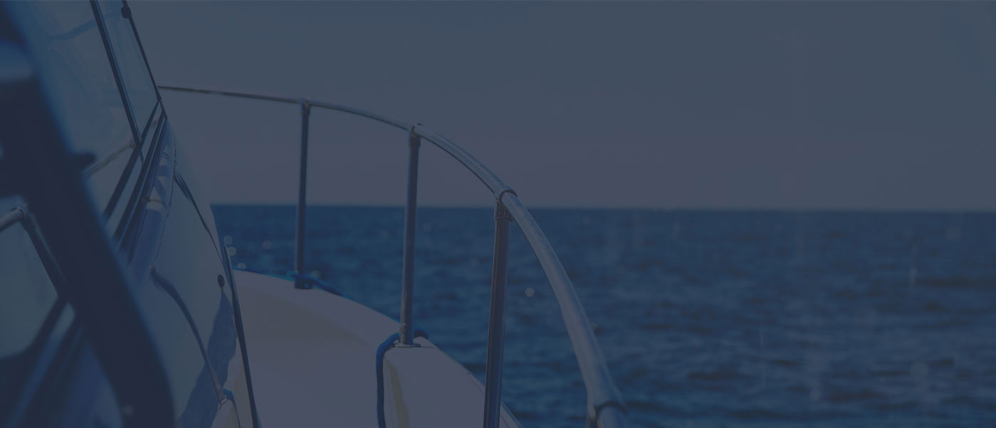 View from a yacht deck overlooking the calm blue ocean on a clear day.