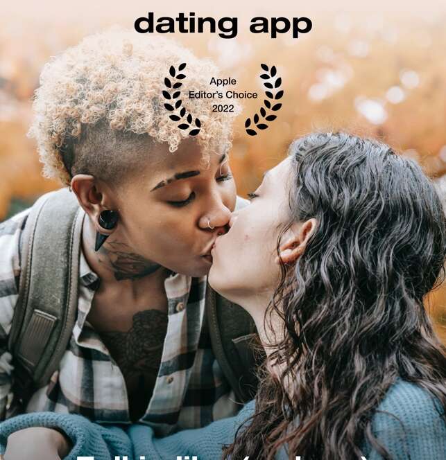 Two people kissing in an outdoor setting.
